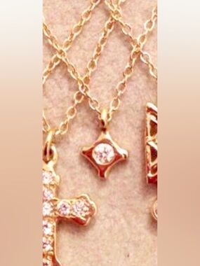 14k gold tiny sweet mini cross necklace with diamond. Retails $345. 17” long.